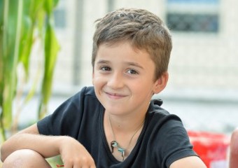 Boy sitting and smiling